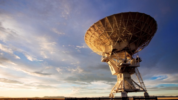 Large government satellite in an open outdoor environment
