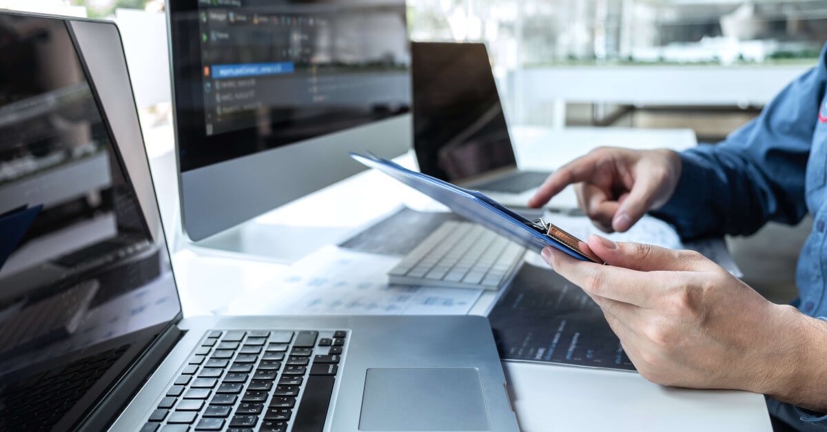 Person reviewing SBOM report at laptop